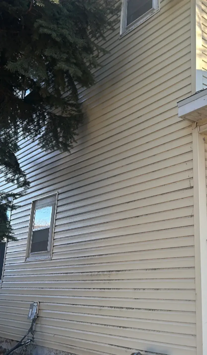 House wash on blue-grey siding