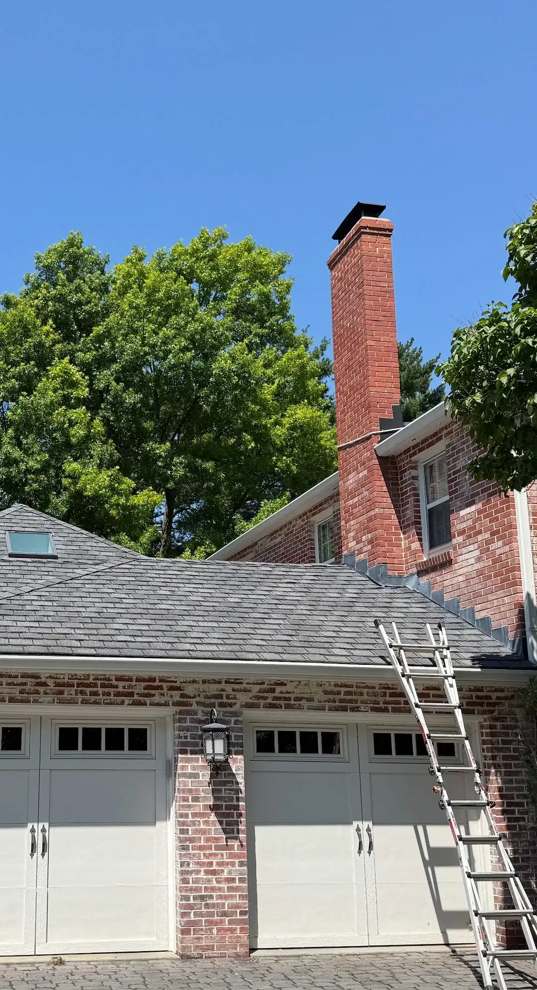 Roof and chimney during a roof cleaning